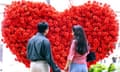Couple Look At Huge Heart Decoration