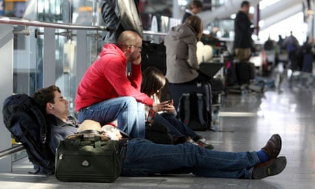 Delayed passengers wait at Heathrow Airport