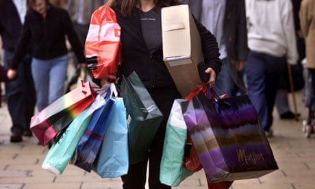 A woman carrying several shopping bags