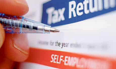 A pen hovers over a self-employed person's tax return
