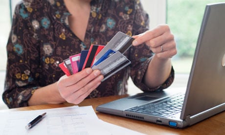 A woman with a fistful of credit cards