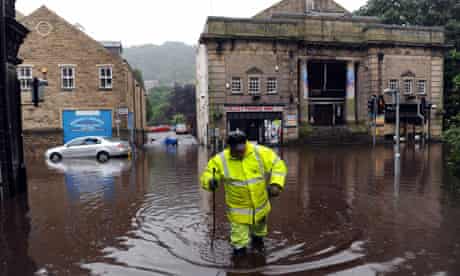 Hebden Bridge hit by floodwaters that surround its cinema and local shops