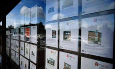 A view of sale and rental properties in an estate agents window