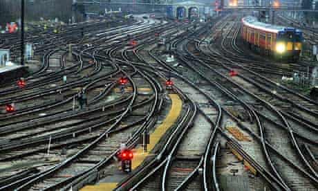 Railway tracks and a train pulling into Clapham Junction