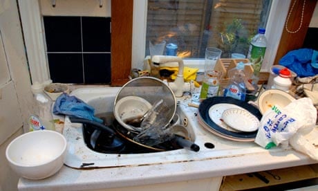 A filthy kitchen sink with dirty dishes