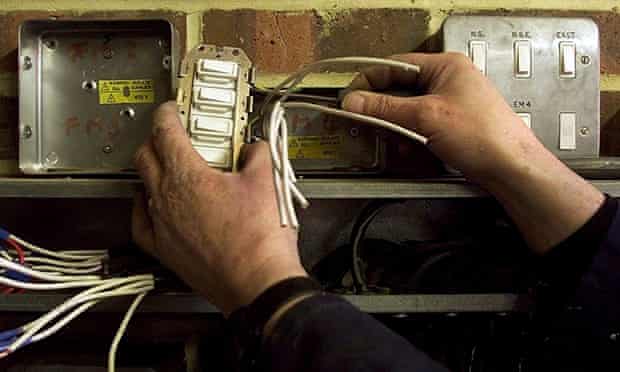 An electrician repairing some wires