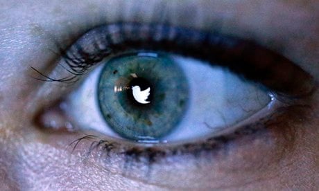 An illustration picture shows the Twitter logo reflected in an eye
