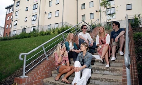 Students sit outside the halls of residence at Nottingham Trent