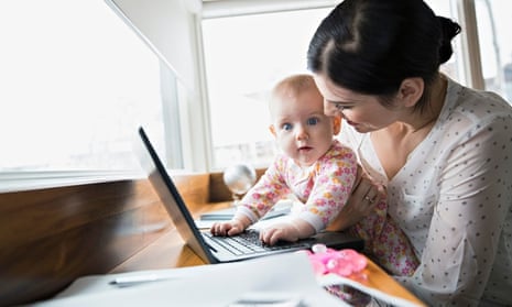 Mother and baby at laptop in home office