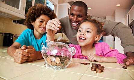 Father, children and piggy bank