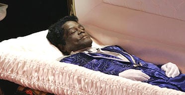 James Brown lies in his open coffin