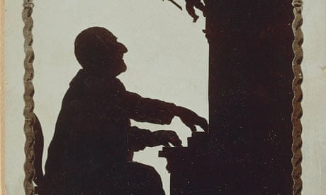 A silhouette of composer Anton Bruckner at the organ