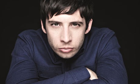 Popstar Example pouts into the camera