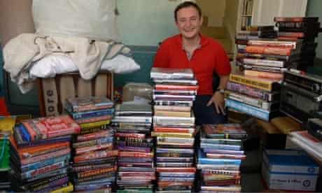Mike Finch with hundreds of 90s rave tapes in a still from the film Tape Crackers