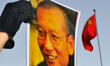A protester holds an image of to jailed dissident Liu outside of the Chinese Embassy in Oslo