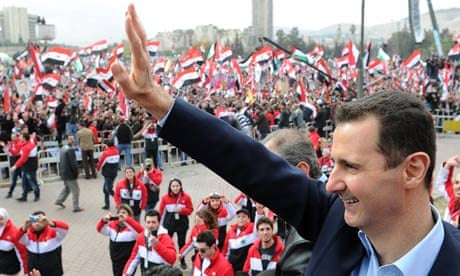 Bashar al-Assad waves to supporters