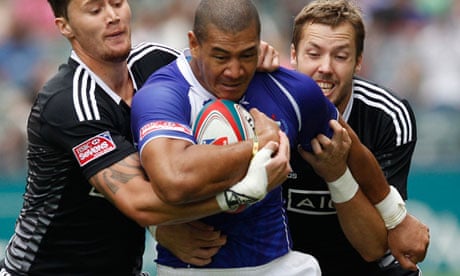 Samoan rugby player Paul Perez being tackled