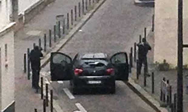 The Charlie Hebdo gunmen in the street.
