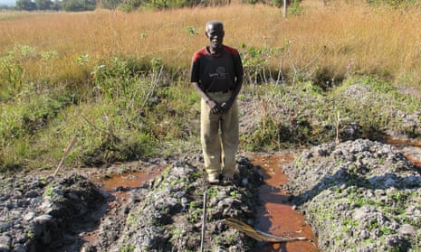 Farmer Langsu Mumbelunga in his polluted field near the Mushishima stream, Zambia.