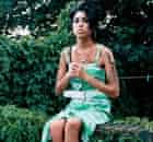 Amy Winehouse sitting on wall