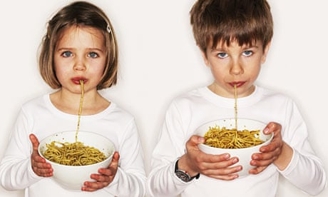 Children eating pasta