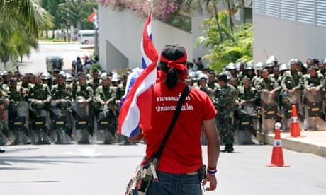 Anti-government red shirt protester with Thai flag