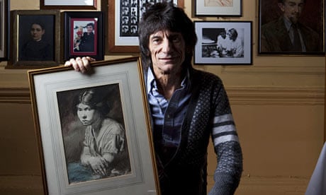 Ronnie Wood with one of his Orpen paintings