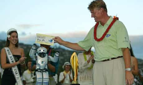 Ernie Els is presented with his winner's cheque