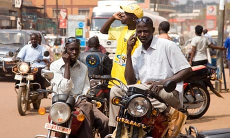 Africa mobile phones in use on the streets of Kampala, Uganda
