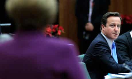 Cameron stares at Angela Merkel