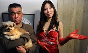 Sex counsellor Ai Aoyama with a client and her dog