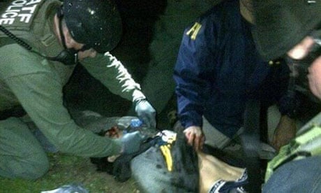 Dzhokhar Tsarnaev being searched by law enforcement officers