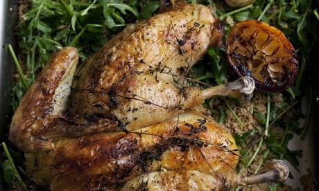 Spatchcocked chicken with rocket couscous in a pan