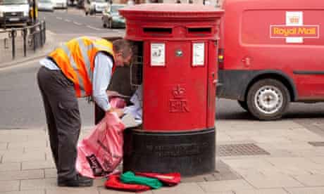 A postman emptying mail from a mailbox