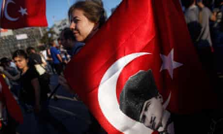 Turkey protester carries flag with Ataturk picture
