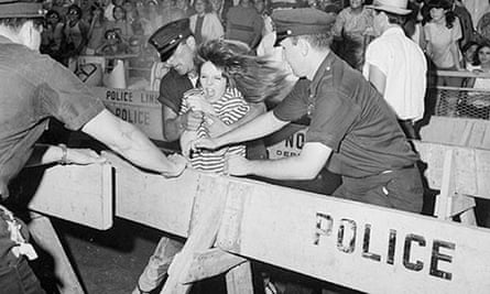 A young Beatles' fan tries to break through a police line at