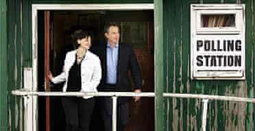 Tony and Cherie Blair leave their local polling station after voting on May 5, 2005