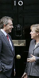 Tony Blair welcomes Angela Merkel to No 10 Downing Street. Photograph: Lefteris Pitarakis / PA
