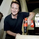 David Cameron, the leader of the Conservative party, helps renovate St Mary's Church in Springbourne, Bournemouth, a project being led by Tobias Ellwood, MP for Bournemouth East. Photograph: Andrew Parsons/Pool/PA.