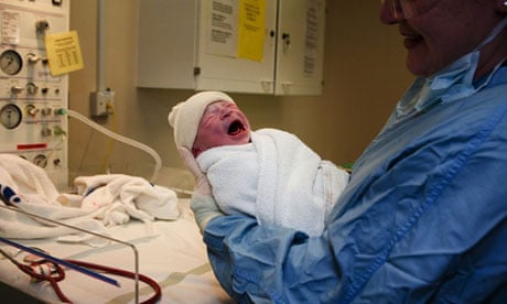 A baby boy is weighed after being born in an NHS maternity unit in Manchester. Photograph: Christopher Furlong/Getty Image
