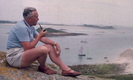 Harold Wilson, the prime minister, sitting quietly smoking his pipe on a rock, during a holiday to the Scilly Isles in 1965. Photograph: Peter King/Fox Photos/Getty Images