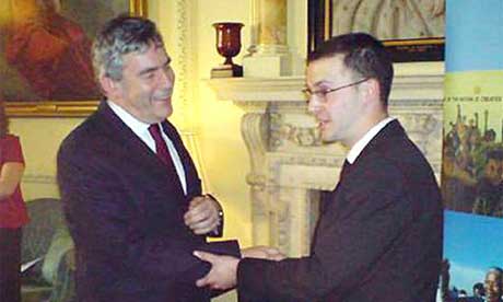 Plane Stupid Activist Dan Glass, being greeted by Gordon Brown, as he tries to glue himself to the prime minister in Downing Street