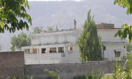 A soldier secures the compound in Abbotabad, Pakistan, where Osama bin Laden was killed