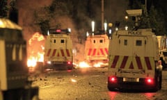 Loyalist rioters use fire bombs on police officers in east Belfast, Northern Ireland, last Wednesday