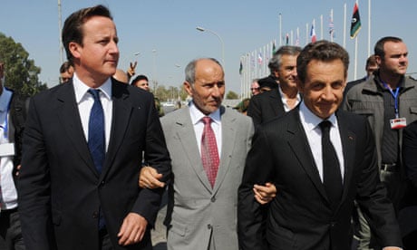 David Cameron and Nicolas Sarkozy flank the NTC chairman, Mustafa Abdel Jalil, in Tripoli, Libya
