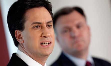 Ed Balls looks at as Ed Miliband discusses economic policy