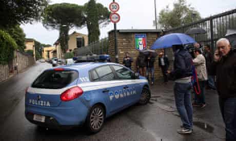 An Italian police car arrives at the site where the Italy national team is training