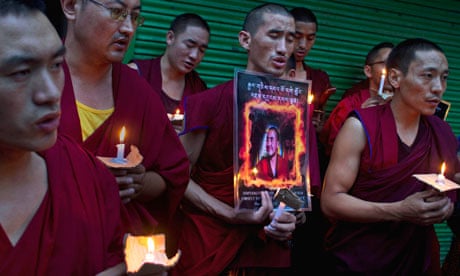 Exiled Tibetan Buddhist monks pray 