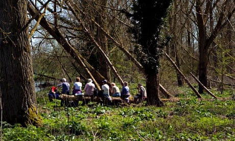 Older people having a picnic while on a walk