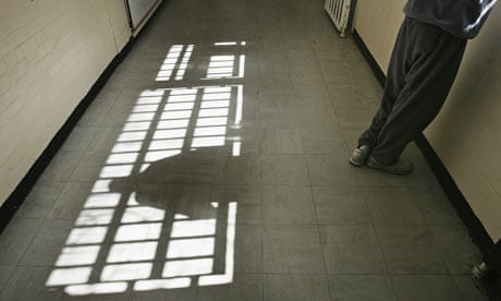 A prison inmate looks out of the window